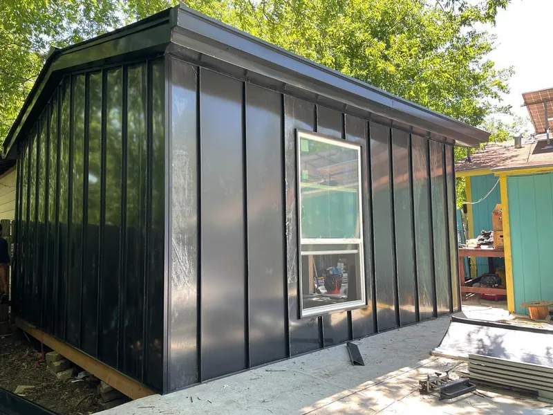 Black standing seam metal wall panels for Roof Inspection in St. Louis Park