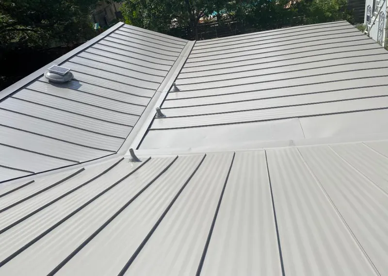 Solar attic fan installed on a metal roof for Roof Ventilation in St. Louis Park