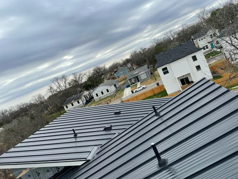 Standing seam metal roof panels with vents for Skylight Repair in St. Louis Park